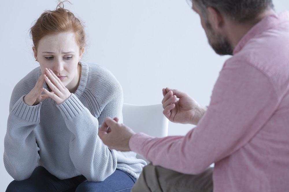 woman consulting a therapist