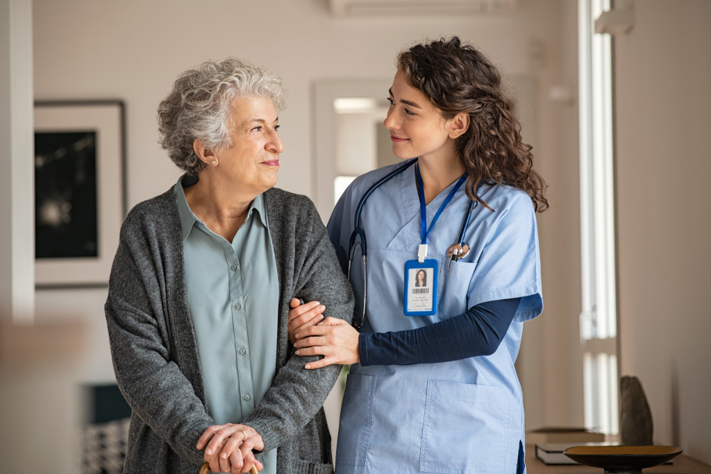 nurse helping a senior